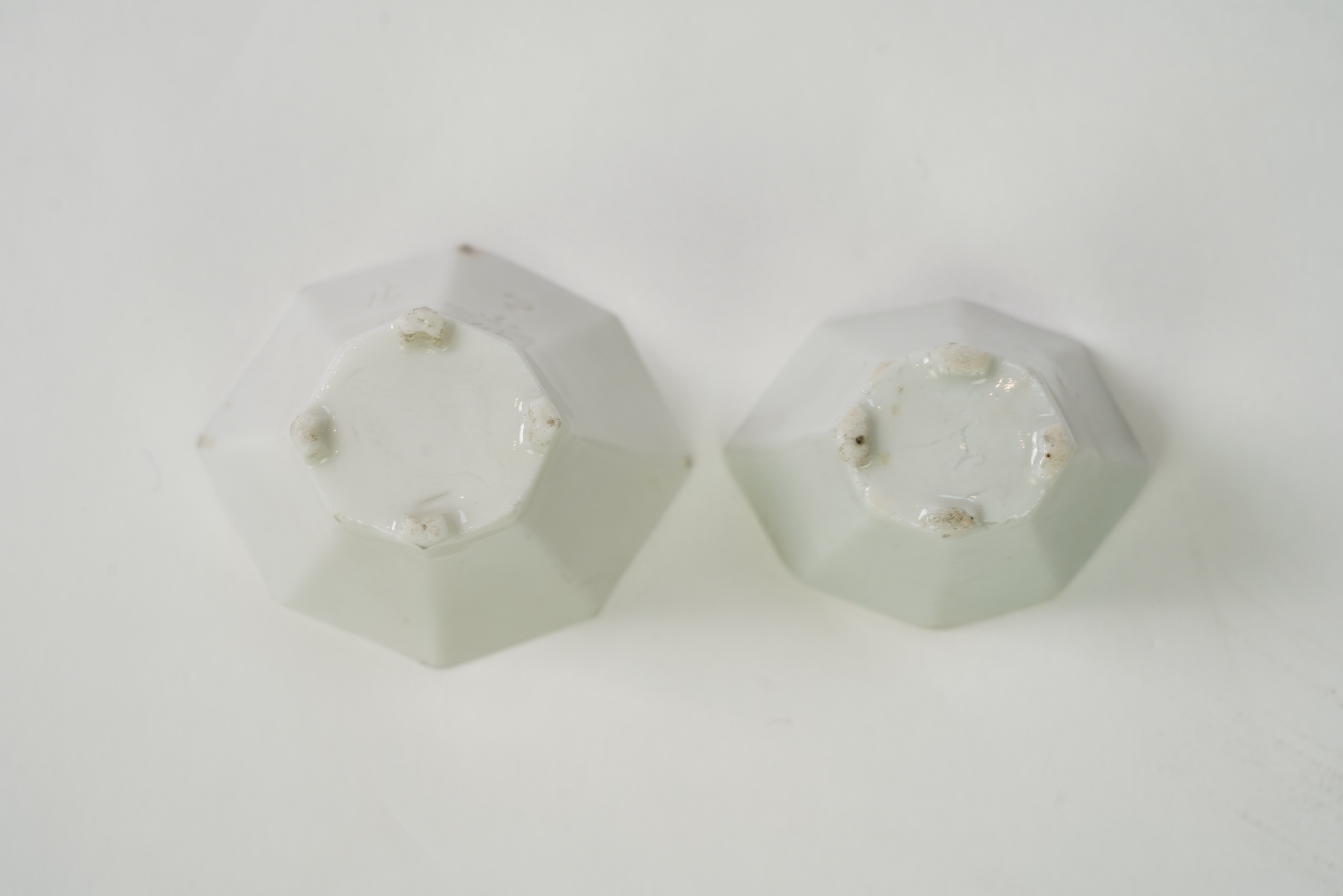 Two Chinese Dehua blanc de chine octagonal cups, Kangxi period